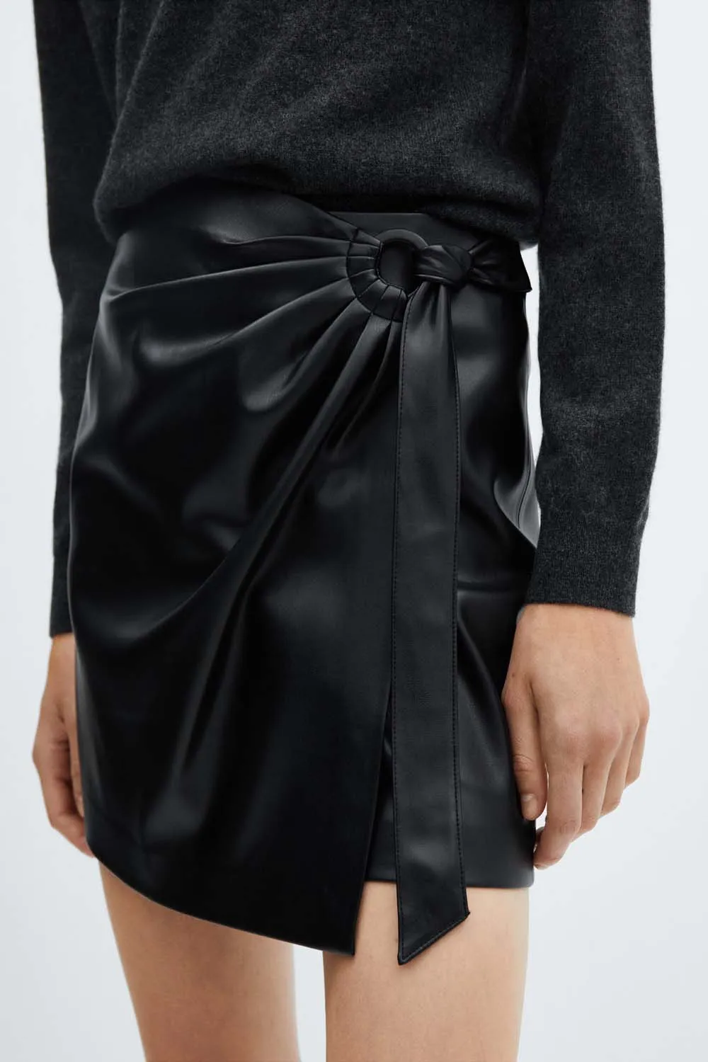 Short leather effect buckled skirt